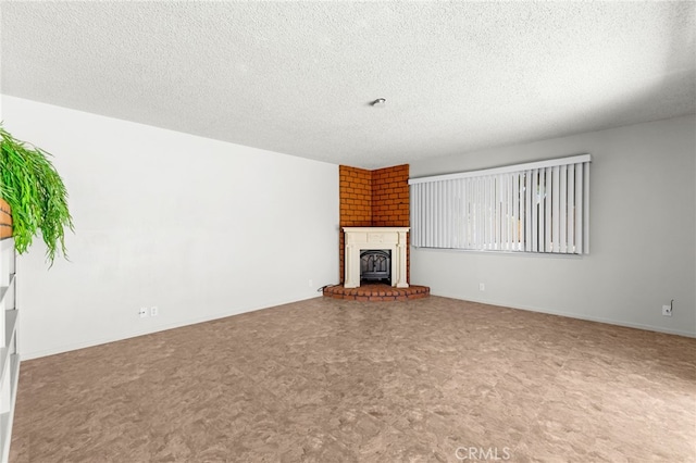 16257 Avalon Ave, Victorville, CA 92395 - unfurnished living room featuring a textured ceiling and a fireplace