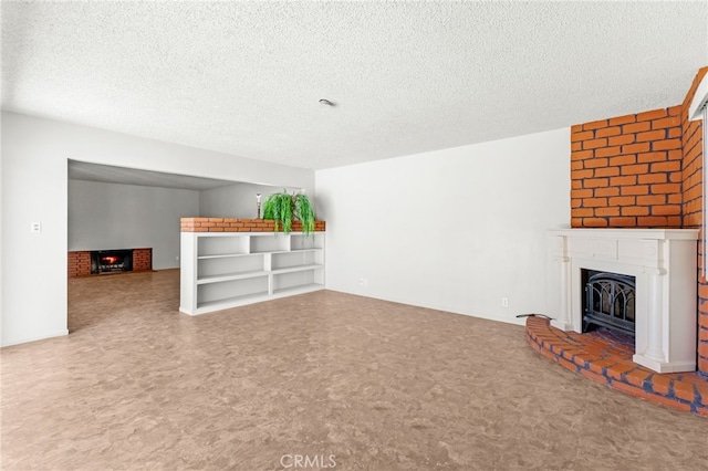 16257 Avalon Ave, Victorville, CA 92395 - unfurnished living room featuring a fireplace and a textured ceiling