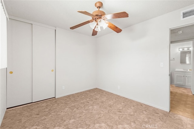 16257 Avalon Ave, Victorville, CA 92395 - unfurnished bedroom featuring a closet and ceiling fan