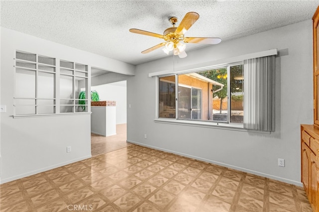 16257 Avalon Ave, Victorville, CA 92395 - empty room with a ceiling fan, light floors, and a textured ceiling