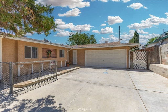 16257 Avalon Ave, Victorville, CA 92395 - ranch-style home featuring stucco siding, an attached garage, and concrete driveway