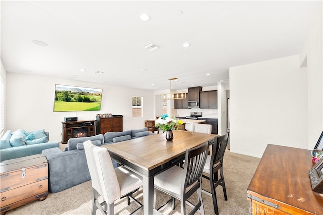 27108 Oncore Dr, Menifee, CA 92585 - dining area with light carpet and recessed lighting