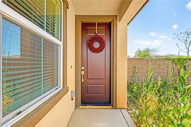 27108 Oncore Dr, Menifee, CA 92585 - doorway to property with stucco siding
