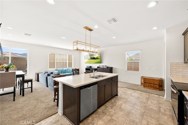 27108 Oncore Dr, Menifee, CA 92585 - kitchen with stainless steel appliances, light colored carpet, light countertops, healthy amount of natural light, and recessed lighting