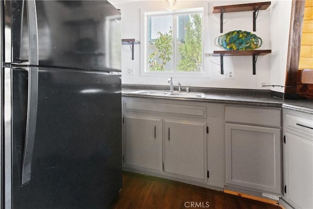 2068 Slippery Elm Rd, Wrightwood, CA 92397 - kitchen with freestanding refrigerator, dark countertops, open shelves, and dark wood-style flooring