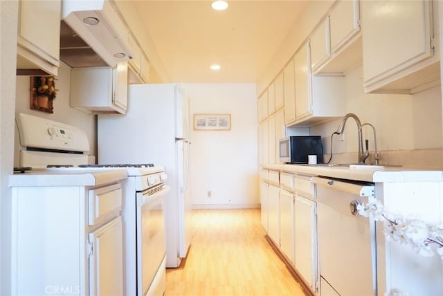 570 W Stocker St Unit 202, Glendale, CA 91202 - kitchen with white range with gas cooktop, stainless steel microwave, light wood-style flooring, recessed lighting, and custom exhaust hood