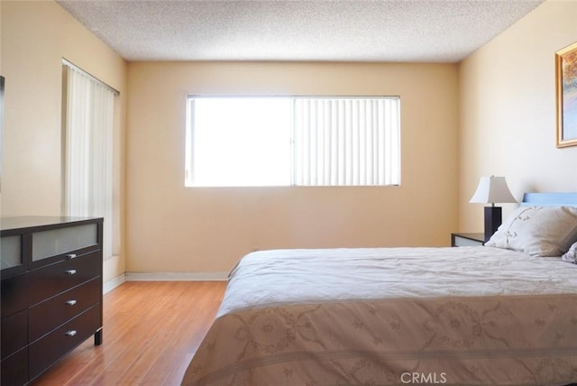 570 W Stocker St Unit 202, Glendale, CA 91202 - bedroom featuring wood finished floors and a textured ceiling