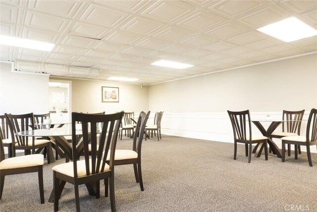 570 W Stocker St Unit 202, Glendale, CA 91202 - carpeted dining space featuring an ornate ceiling and a wainscoted wall