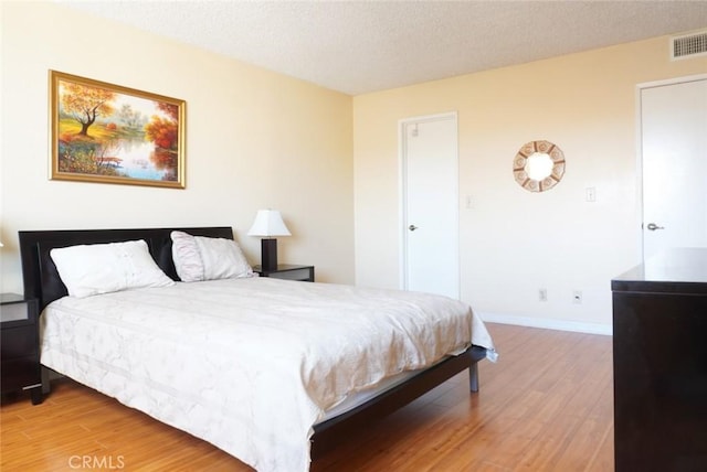 570 W Stocker St Unit 202, Glendale, CA 91202 - bedroom featuring light wood finished floors and a textured ceiling