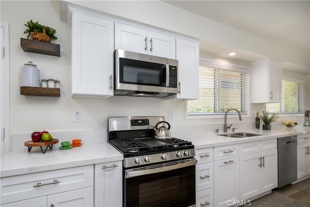 1610 Wandering Dr, Monterey Park, CA 91754 - kitchen featuring appliances with stainless steel finishes, open shelves, white cabinets, plenty of natural light, and recessed lighting