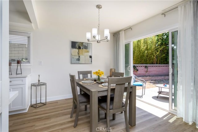 1610 Wandering Dr, Monterey Park, CA 91754 - dining room featuring light wood-style flooring and a chandelier