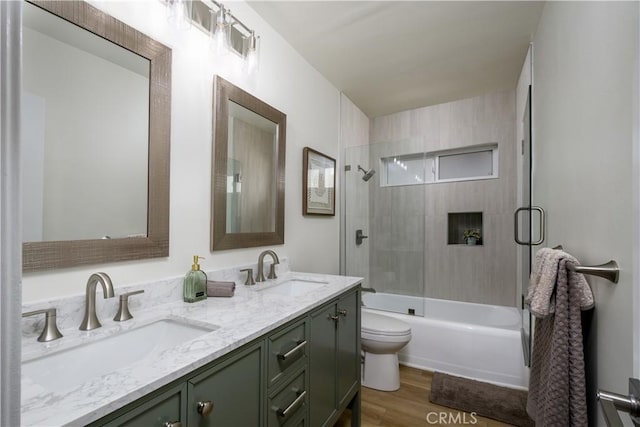 1610 Wandering Dr, Monterey Park, CA 91754 - bathroom with wood finished floors, double vanity, and bath / shower combo with glass door