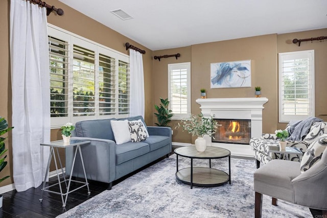 27002 Red Maple St, Murrieta, CA 92562 - living area featuring healthy amount of natural light and a glass covered fireplace