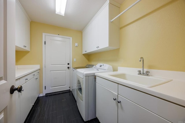 27002 Red Maple St, Murrieta, CA 92562 - laundry area with cabinet space, washing machine and clothes dryer, and dark wood-style floors