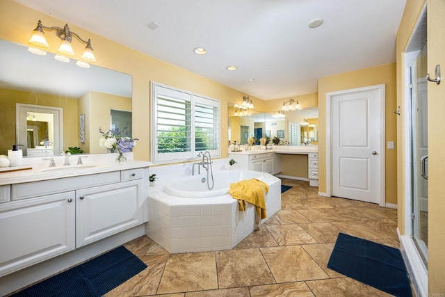 27002 Red Maple St, Murrieta, CA 92562 - bathroom featuring two vanities, a bath, a shower stall, a chandelier, and recessed lighting
