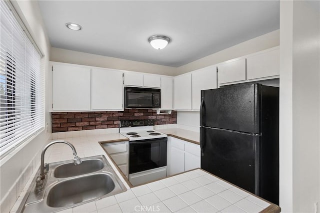 10249 Black Mountain Rd Unit Q3, San Diego, CA 92126 - kitchen featuring black appliances, decorative backsplash, white cabinetry, and a peninsula