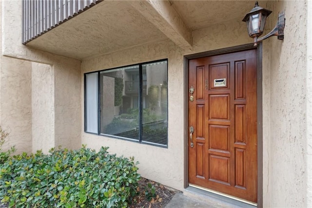 10249 Black Mountain Rd Unit Q3, San Diego, CA 92126 - doorway to property featuring stucco siding