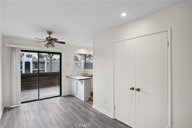 10249 Black Mountain Rd Unit Q3, San Diego, CA 92126 - unfurnished living room with wood finished floors, ceiling fan, and recessed lighting