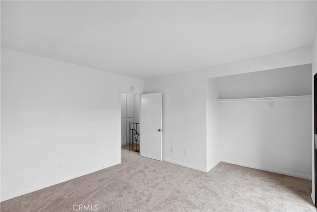 10249 Black Mountain Rd Unit Q3, San Diego, CA 92126 - unfurnished bedroom featuring carpet flooring and a closet