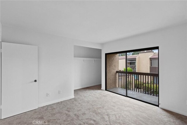 10249 Black Mountain Rd Unit Q3, San Diego, CA 92126 - unfurnished bedroom featuring carpet, access to outside, and a closet