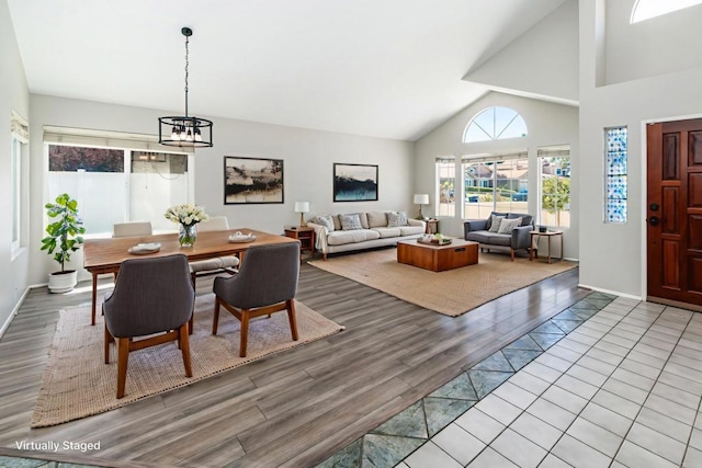 30602 Colina Verde St, Temecula, CA 92592 - dining area featuring wood finished floors, a chandelier, and high vaulted ceiling