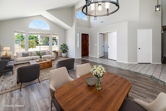 30602 Colina Verde St, Temecula, CA 92592 - living room featuring wood tiled floors, a chandelier, and high vaulted ceiling