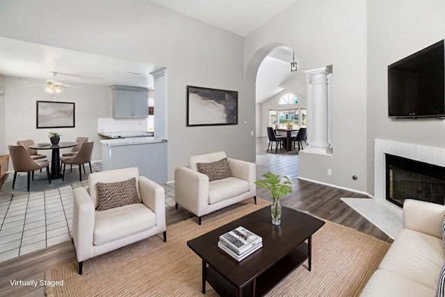30602 Colina Verde St, Temecula, CA 92592 - living area featuring decorative columns, ceiling fan, arched walkways, wood finished floors, and lofted ceiling