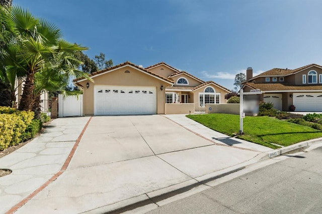 30602 Colina Verde St, Temecula, CA 92592 - mediterranean / spanish house with an attached garage, driveway, stucco siding, and a tile roof