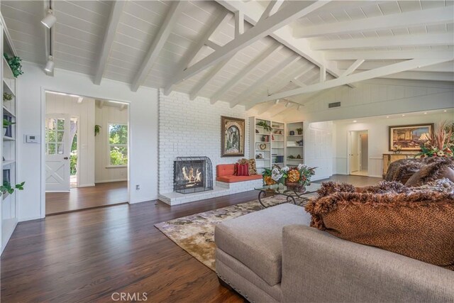 3131 E Cortez St, West Covina, CA 91791 - living room with wood finished floors, a fireplace, track lighting, and built in features