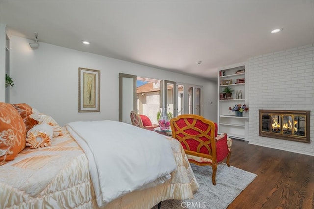 3131 E Cortez St, West Covina, CA 91791 - bedroom with wood finished floors, a brick fireplace, and recessed lighting