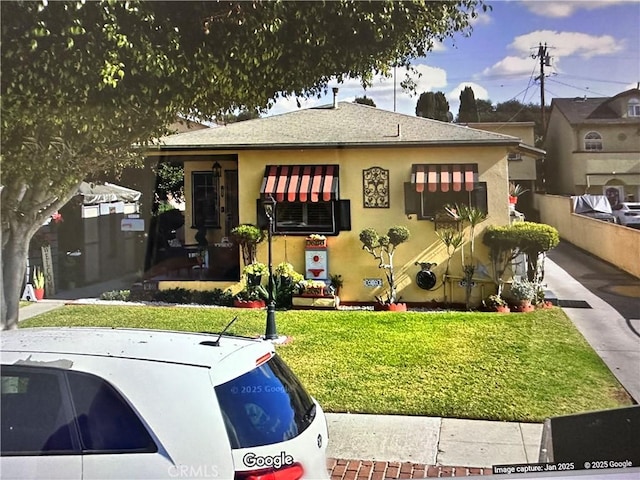 9400 San Miguel Ave, South Gate, CA 90280 - bungalow-style home with a front lawn, stucco siding, and roof with shingles