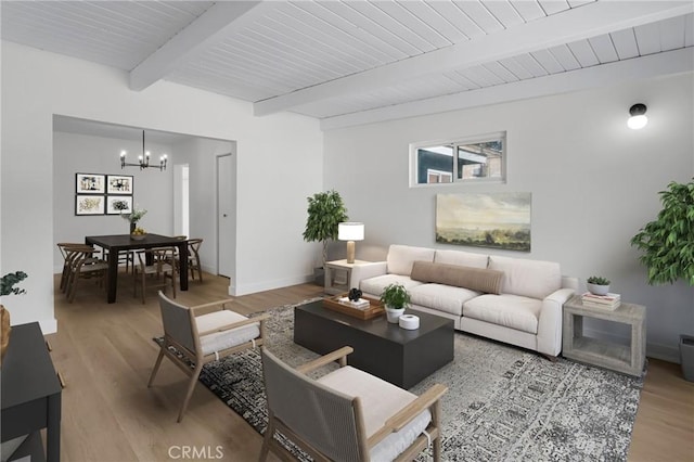 4713 Calada Ave, Pico Rivera, CA 90660 - living area with a chandelier, light wood-type flooring, and beam ceiling