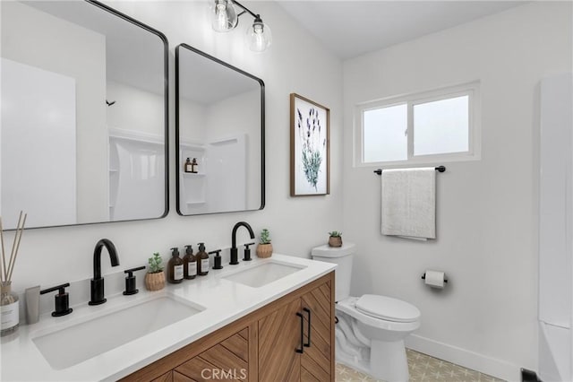 4713 Calada Ave, Pico Rivera, CA 90660 - bathroom featuring double vanity and toilet