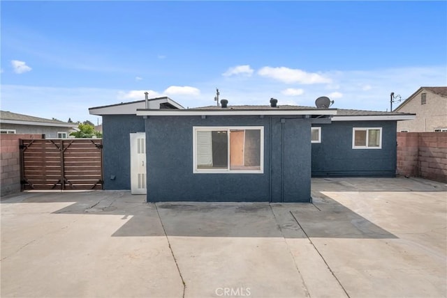 4713 Calada Ave, Pico Rivera, CA 90660 - back of property with a patio area and stucco siding