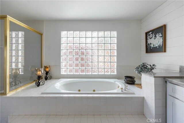 1244 St Anton Dr, Lake Arrowhead, CA 92352 - bathroom with a tub with jets, vanity, and tile patterned flooring