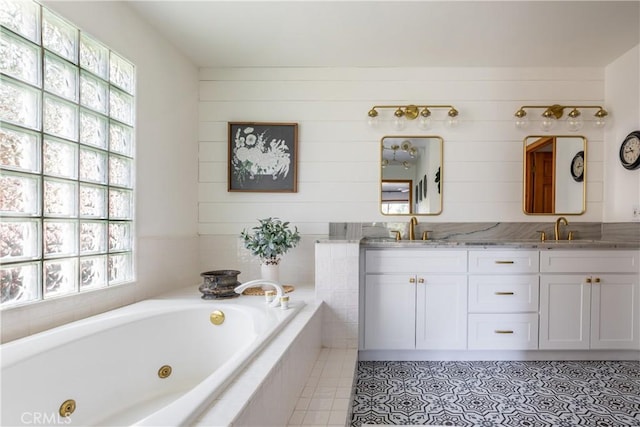 1244 St Anton Dr, Lake Arrowhead, CA 92352 - bathroom featuring double vanity, a jetted tub, and tile patterned floors
