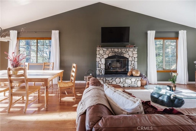 1244 St Anton Dr, Lake Arrowhead, CA 92352 - living area with vaulted ceiling, wood finished floors, and a fireplace