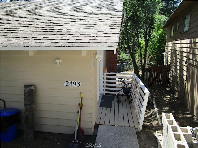 2493 Palo Alto Way, Running Springs, CA 92382 - view of exterior entry with roof with shingles and a deck