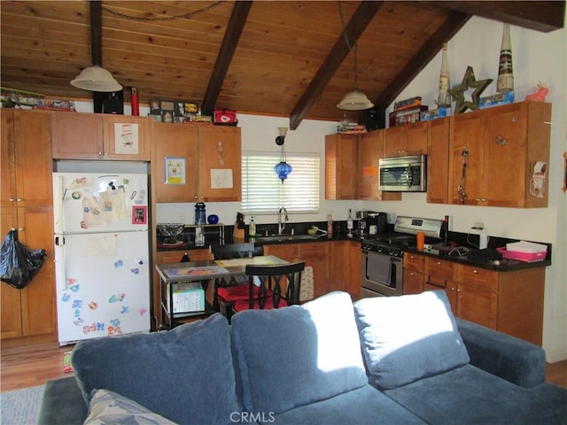 2493 Palo Alto Way, Running Springs, CA 92382 - kitchen featuring stainless steel appliances, wood finished floors, dark countertops, brown cabinets, and wooden ceiling
