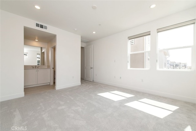474 Lobata, Irvine, CA 92618 - unfurnished bedroom featuring light colored carpet, recessed lighting, and ensuite bath