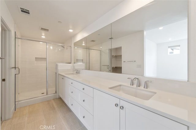 474 Lobata, Irvine, CA 92618 - full bathroom with double vanity, a shower stall, and recessed lighting