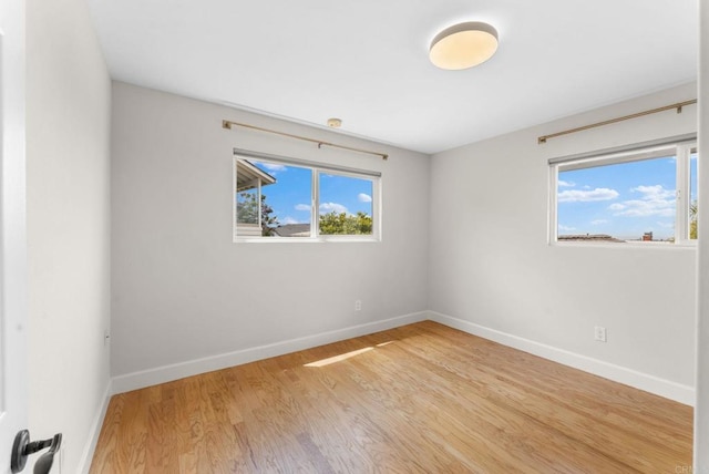 3903 Cadden Way, San Diego, CA 92117 - unfurnished room with light wood-style floors and baseboards