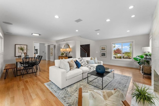 3903 Cadden Way, San Diego, CA 92117 - living area featuring light wood-type flooring and recessed lighting