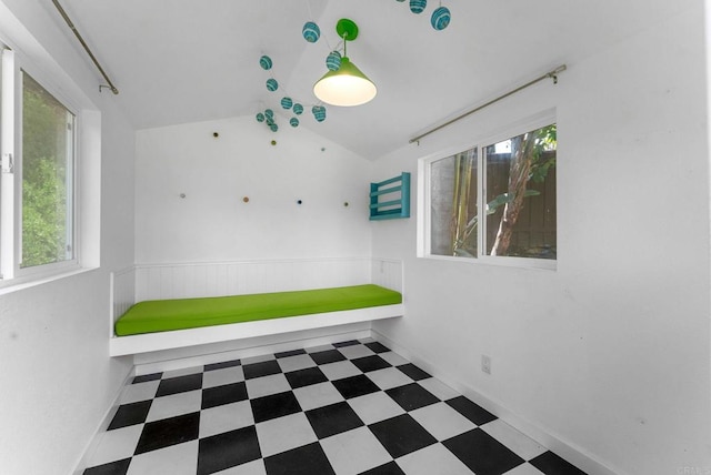 3903 Cadden Way, San Diego, CA 92117 - spare room with lofted ceiling, tile patterned floors, and wainscoting