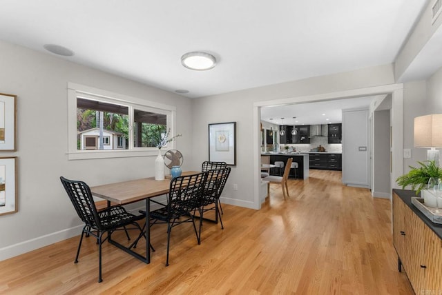 3903 Cadden Way, San Diego, CA 92117 - dining space with light wood finished floors and baseboards