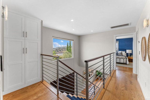 3903 Cadden Way, San Diego, CA 92117 - hallway featuring an upstairs landing, light wood-style floors, and recessed lighting