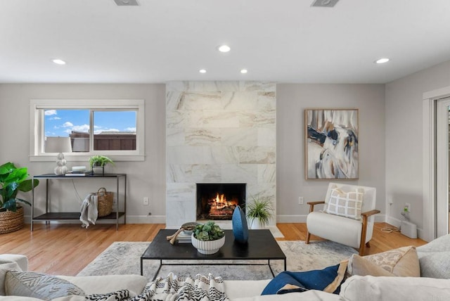 3903 Cadden Way, San Diego, CA 92117 - living area featuring recessed lighting, a high end fireplace, and wood finished floors