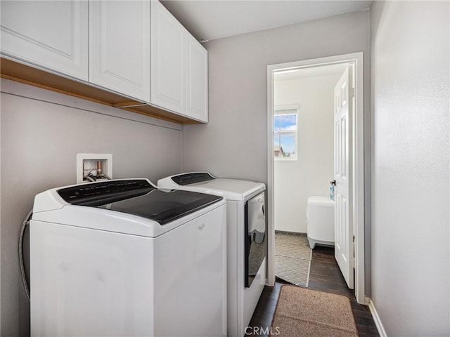 11760 Espola Pl, Victorville, CA 92392 - laundry area with cabinet space, washing machine and dryer, and dark wood-style floors