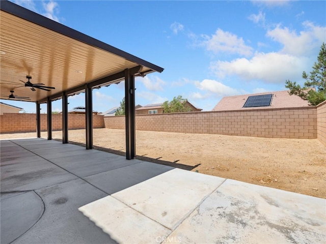 11760 Espola Pl, Victorville, CA 92392 - fenced backyard featuring ceiling fan and a patio