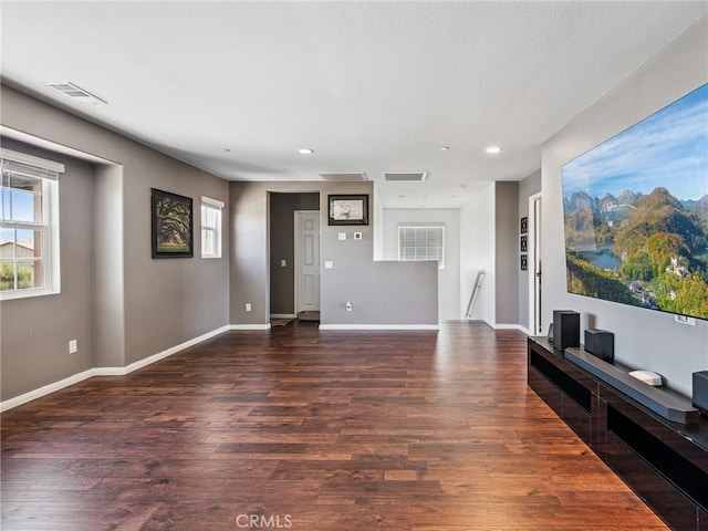 11760 Espola Pl, Victorville, CA 92392 - unfurnished living room featuring dark wood-style flooring and recessed lighting